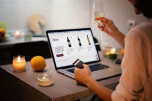 A Japanese wine enthusiast choosing a bottle to order on Wine Kiosk website